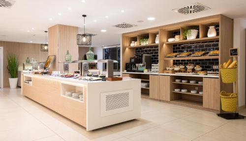 a bakery with a counter with aasteryasteryasteryasteryasteryasteryasteryasteryastery at Tomir Portals Suites - Adults Only in Portals Nous