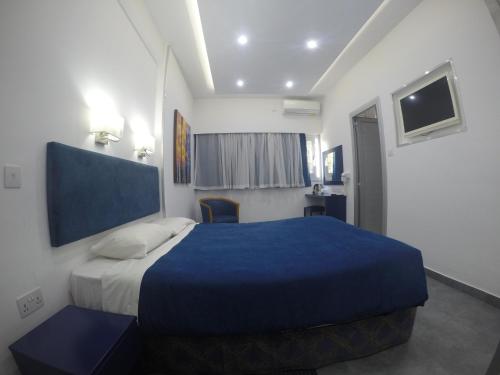 Postel nebo postele na pokoji v ubytování Asty Hotel