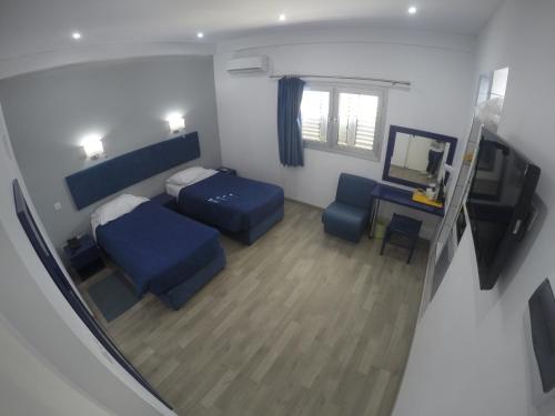 TV a/nebo společenská místnost v ubytování Asty Hotel