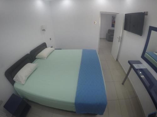 Postel nebo postele na pokoji v ubytování Asty Hotel