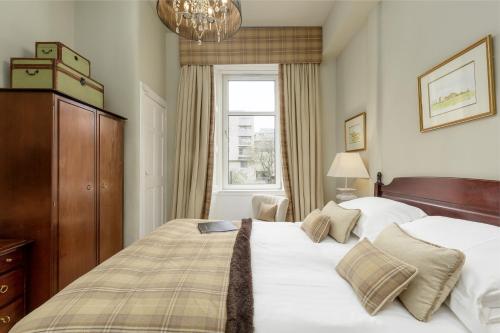 Un pat sau paturi într-o cameră la Ben Cruachan Guest House