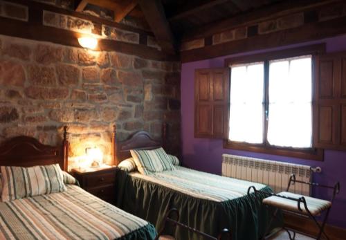 Tempat tidur dalam kamar di Casa Rural La Panera