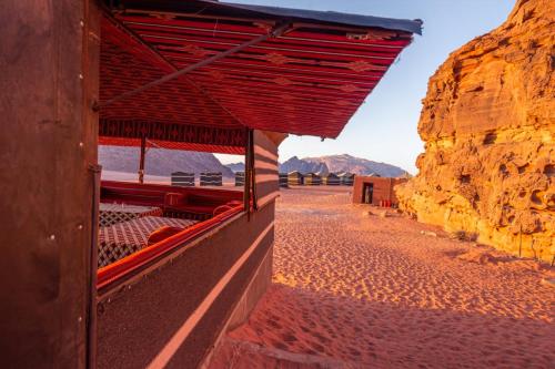 a building in the desert with a view of a mountain at Wadi rum desert breath in Wadi Rum