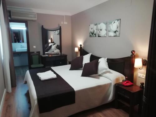 Posteľ alebo postele v izbe v ubytovaní Hotel Montearoma