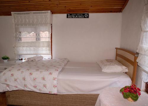 a bedroom with two beds and a window at Eren Villa in Sapanca