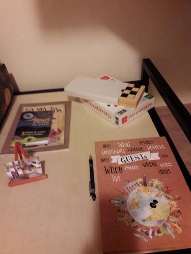 a white refrigerator with books on top of it at Bella Civita in Bagnoregio