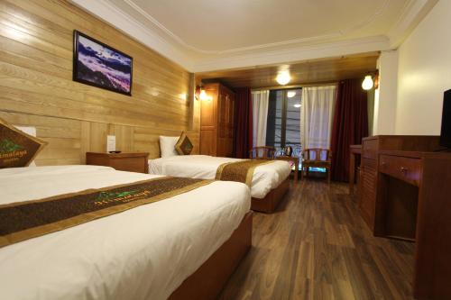 Giường trong phòng chung tại Himalaya Sapa Hostel