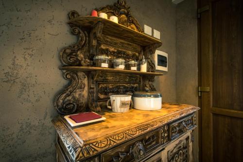 a wooden table with a shelf on top of it at TENUTA I TUFARI in Tivoli