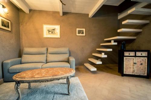 a living room with a couch and a coffee table at TENUTA I TUFARI in Tivoli