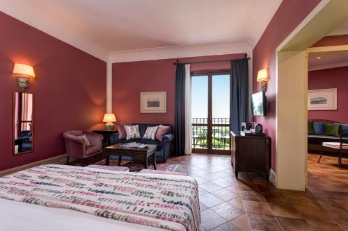 Postel nebo postele na pokoji v ubytování Hotel Baglio Oneto dei Principi di San Lorenzo - Luxury Wine Resort
