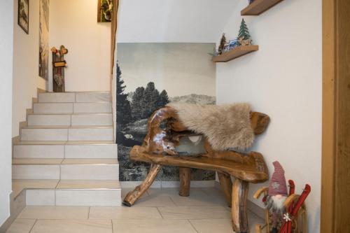 a room with a chair with fur on it at Apart Garni Sesvenna in Ischgl