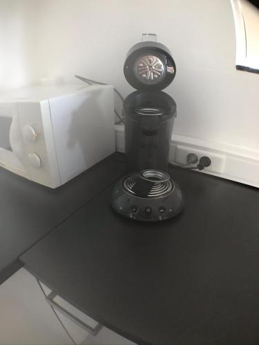 a clock sitting on top of a table at Les rives de Sax in Dinant