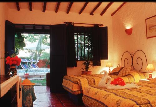 מיטה או מיטות בחדר ב-Hotel Costa Linda Beach
