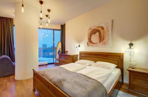 Postel nebo postele na pokoji v ubytování Helios 19 Luxury Vilnius Apartment