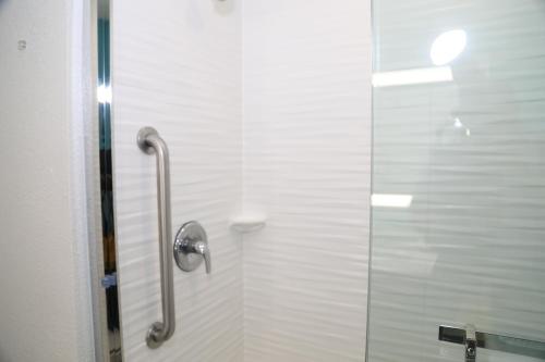 a shower with a glass door in a bathroom at La Quinta by Wyndham Montgomery in Montgomery