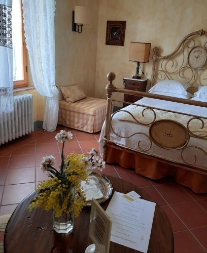 Ένα ή περισσότερα κρεβάτια σε δωμάτιο στο Agriturismo Borgo La Casetta