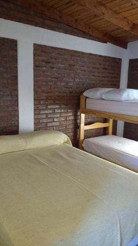 Een bed of bedden in een kamer bij Los Patitos