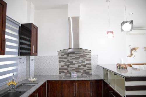Kuchyň nebo kuchyňský kout v ubytování J&R Residence