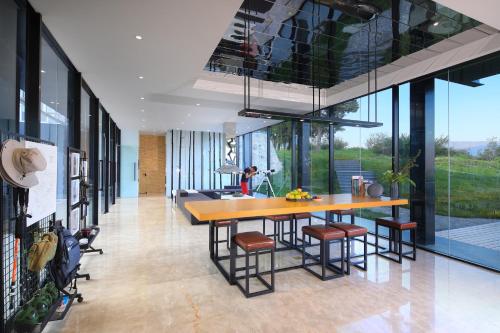 a dining room with a table and some chairs at The Rock Hotel in Lijiang