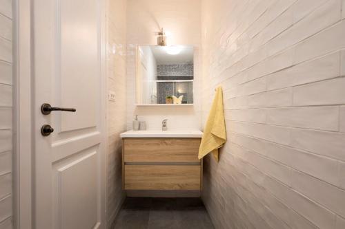 a bathroom with a sink and a mirror at Mulberry Stonehouse in Primošten