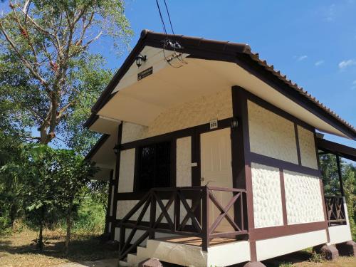 a small house with a porch and a door at RS Phong Riverside Resort in Khon Kaen