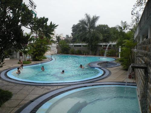 a group of people in a swimming pool at Nasiklub in Nashik