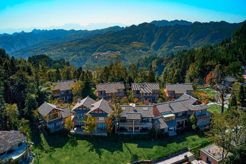 an aerial view of a large house in the mountains at Evergreen Retreat-walk to National Forest Park, free pick up service in Zhangjiajie