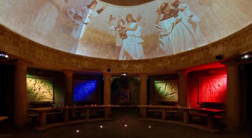a stage with a large painting on the wall at Wine & Spa Complex Starosel in Starosel