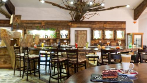 a restaurant with a table with a piece of cake on it at Wine & Spa Complex Starosel in Starosel