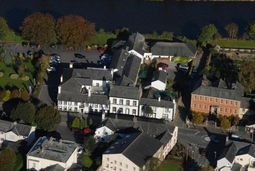 arial view of a town with houses and the water at Trout Hotel in Cockermouth
