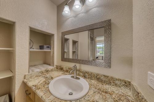 a bathroom with a sink and a mirror at Wailea Grand Champions in Wailea