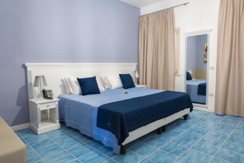 Postel nebo postele na pokoji v ubytování Galìa Luxury Resort