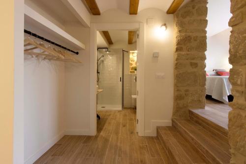 a hallway in a house with a stone wall at El Mirador de Eloísa in Rodezno