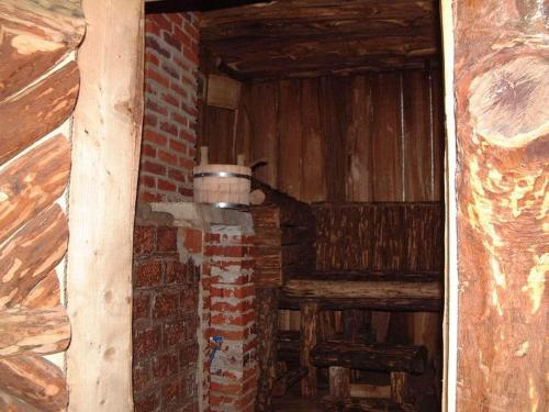 a room with a brick wall and a pot at Hotel Intourist in Mukacheve