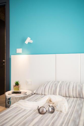 a bed with a pair of glasses on top of it at Hotel Abc in Cervia
