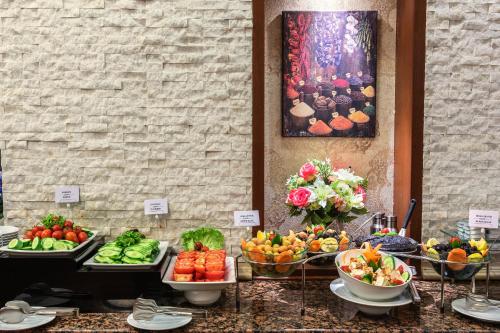a buffet of fruits and vegetables on a table at Grand Yavuz Hotel Sultanahmet in Istanbul