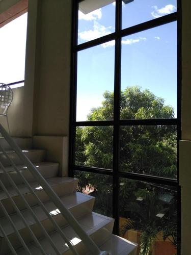 a view of a stairway from a building with a window at V.F. Riton Apartelle in Laoag