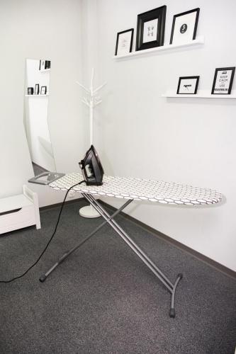a desk with a keyboard and a computer monitor at Ibis Poznan Stare Miasto in Poznań
