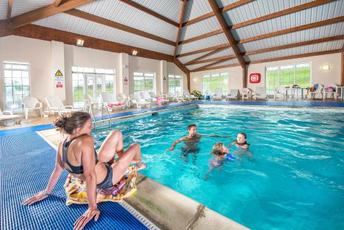a group of people in a swimming pool at Widemouth Bay Caravan Park in Bude