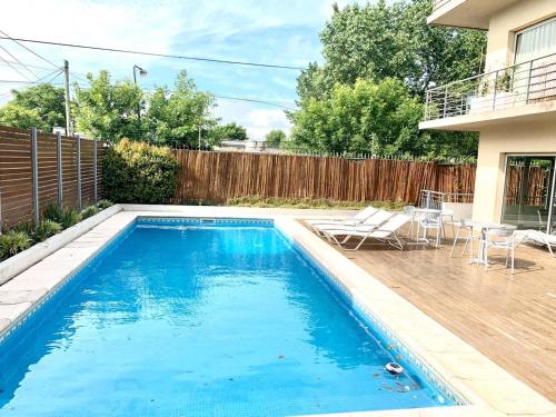 a swimming pool in the backyard of a house at Departamento Alassio in Tigre