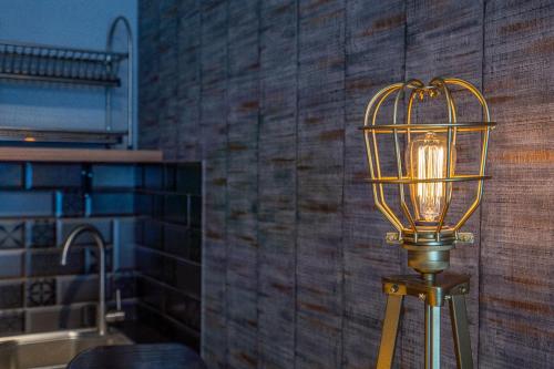 a bird cage light on a pole in a room at Deer Valley - New Gudauri in Gudauri