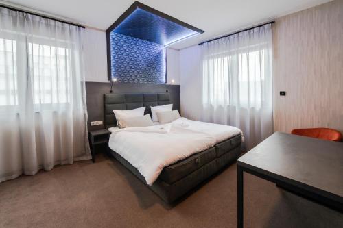 Postel nebo postele na pokoji v ubytování premium by GS Hotel
