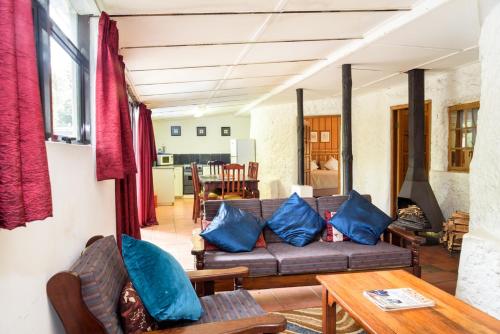 a living room with a couch and a table at Kings Lodge Hotel in Hogsback