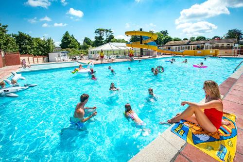 a group of people in a swimming pool at Trelawne Manor Holiday Park in Looe