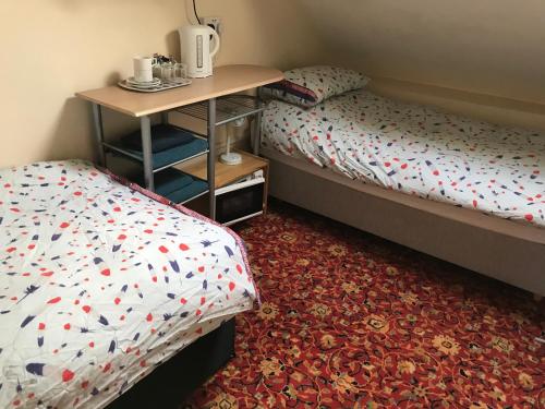 Кровать или кровати в номере Bayside Guest House