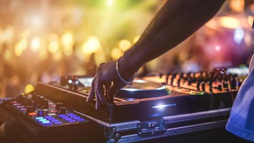 a person playing a mixing console in a nightclub at PLACES Hvar Hotel by Valamar in Stari Grad