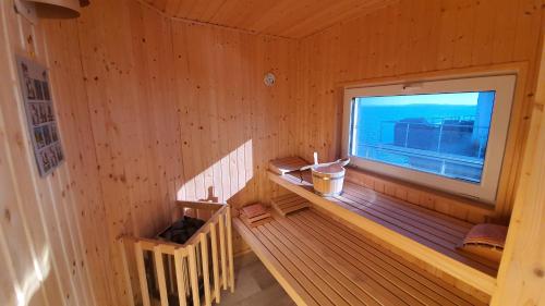 an inside view of a wooden cabin with a window at Goitzsche Resort in Bitterfeld