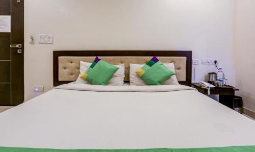 Hotel Royal Elite Maduraiにあるベッド