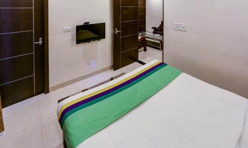 Hotel Royal Elite Maduraiにあるベッド