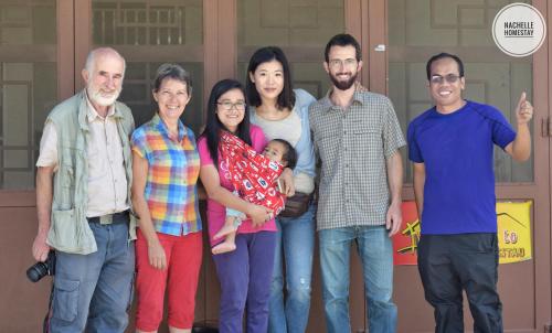 a group of people posing for a picture at Nachelle Homestay in Berastagi